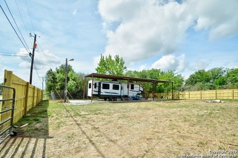 Excellent Double Lot with everything ready to move your RV camper on. Fully fenced yard and brand new 60' x 19' covered RV Carport which provides ample patio space. Covered Carport includes water hookups for washer and dryer, overhead lighting, and f...