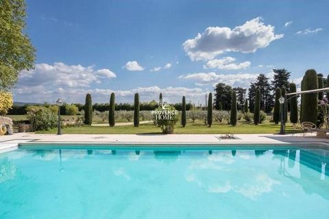Provence Home, the Luberon real estate agency, is offering for sale, a magnificent property with a majestic entrance through a tall wrought-iron gate supported by stone pillars, opening onto a driveway lined with olive trees leading to the stone buil...