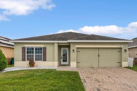 Welcome to the epitome of comfort nestled within the highly sought after Hammock Trails community. This meticulously designed 3 bedroom, 2 bathroom home PLUS a bonus den and a spacious 2-car garage, provides plenty of space for both relaxation and co...