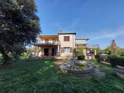 Stone villa in super-popular Brtonigla on 12 634 sq.m. of land! Total floorspace of the building is 330 sq.m. Villa was built in 1973 and modernized in 2015. It consists of 3 apartments and is spread over the ground floor and first floor.   On the gr...