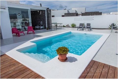 Estupendo is pleased to offer for sale this stylish four bedroomed semi-detached villa in Playa Blanca decorated with the most modern exclusive furniture and features a huge window from the lounge with stunning views to the mountains. One bedroom fea...