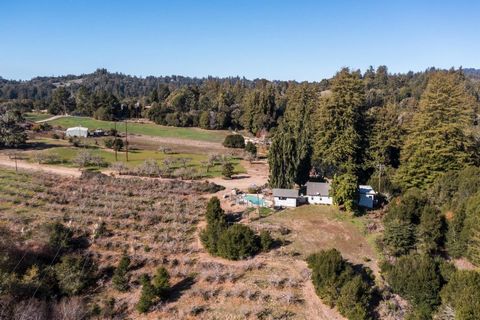Perched atop the hills of Aptos, this property boasts sun-drenched land showcasing an array of features, from apple orchards to majestic redwoods and sprawling meadows. The single level home, conveniently situated with easy access via Valencia School...