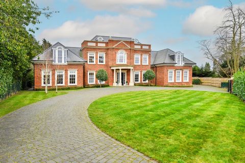 This extraordinary 10,949 sqft house is set within a 0.73-acre of private land in one of Cobham's most exclusive private enclaves, the Oxshott Way Estate. Set behind two sets of electric gates, the property has a beautiful, symmetrical facade and swe...