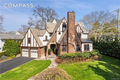 Sleek and timeless, this Tudor has been completely reimagined and designed for today's modern lifestyle. The exterior beckons with storybook architecture and landscaping that leads into this completely upgraded home which perfectly blends old and new...