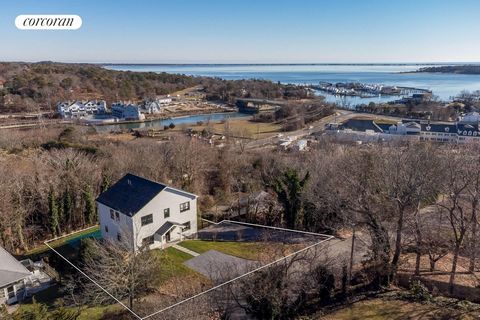 Astonishing water views from this new construction home set over 3 above ground levels. This 5 Bedroom, 3.5 bath home offers approximately 3200 square of indoor living space PLUS the added bonus of three levels of wrap around decking and patio space ...