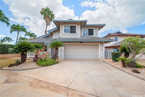 Breathtaking views of the Kapolei golf course, golf club, fountain, and lake await you! Located on the exclusive Oaniani Place, a quiet cul-de-sac elevated above the golf course, this residence boasts panoramic vistas all the way to Diamond Head, cre...