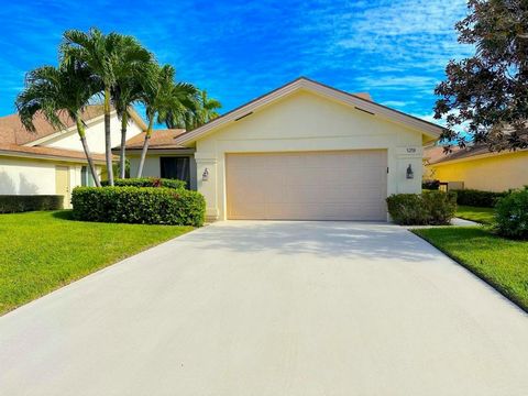 BEST BUY IN THE BLUFFS! PRICE REDUCED FOR A QUICK SALE! Incredible Opportunity in Desirable Jupiter just minutes to the BEACH! This 3/2 CBS home with 2-car garage boasts the lowest HOAs in the area, ready for your own touches. Situated on a level lot...
