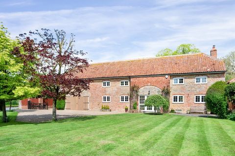 Threshing Barn occupies a desirable position on the edge of the village, set within mature grounds of around 0.25 acres. Built of stone and brick and dating back to the 19th century this five bedroom home features a double height entrance hall with o...