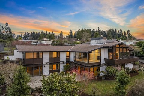 Absolutely captivating breathtaking allure 5 bed 5 bath mid-century modern with open concept, exposed beams and expansive glass walls will connect you with the natural world. Enjoy 270 degree sunset views of the Seattle skyline and Lake Washington. C...