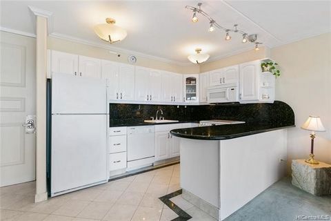 Beautifully remodeled highly sought after end corner unit with additional windows for the Hawaiian trade winds. This thoughtfully appointed home features Tiara Marble through out the home with European interior design features such as crown molding, ...
