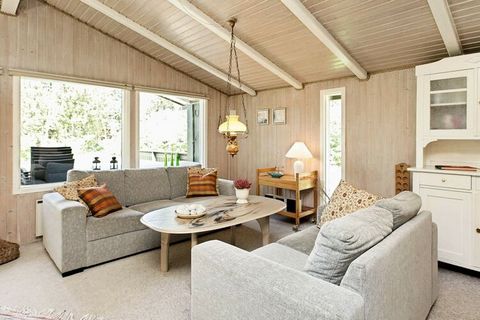 On a closed road, in the middle of Blåbjerg Plantation, you find this holiday cottage with a sauna. From the bathroom you can access the sauna for 4 people. There is an open connection between the living room and well-equipped kitchen. The large wind...