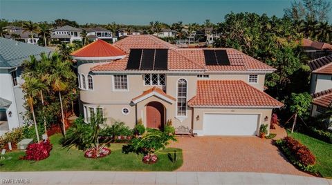 Magnificent Coastal-Style Living in Naples, Florida! This luxurious interior offers a fabulous gourmet kitchen and beautiful Travertine marble flooring. Designer decorated including gorgeous pieces. This Home is a showcase of Designs. Excellent floor...
