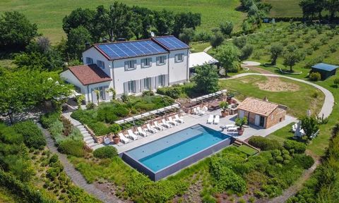 This luxurious villa is an incredibly special 5-bedroom family house offering 555m2 of beautifully presented accommodation set over three floors right in the heart of the marchigiano rolling hills. The current owners carried out a significant restora...