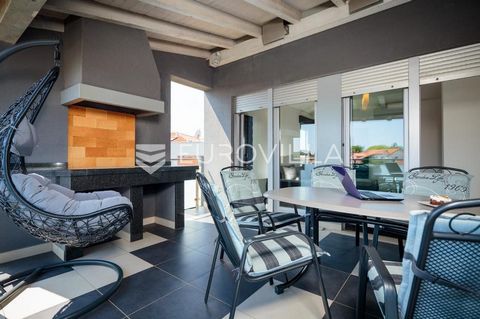 The apartment consists of a large entrance hall, two spacious bedrooms, modernly furnished. Each room has large aluminum windows. The spacious, bright kitchen is fully equipped, the living room has access to the covered terrace, where a stone firepla...