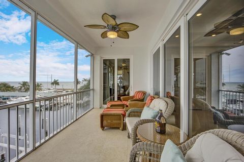 This stunning top floor end unit in Bay Harbour with ocean and harbor views from every room also includes a 50' boat slip with Boat Lift! BAY HARBOUR ALLOWS 7-DAY RENTALS with a Village of Islamorada Vacation Rental License. The interior design is sp...