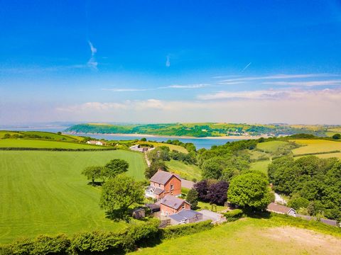 Nestled on the outskirts of the picturesque village of Broadlay, Ferryside, Parc Y Bryn House & Lodge offers an enchanting retreat with exceptional countryside views of rolling hills and across the estuary to Llansteffan castle. This spectacular Edwa...