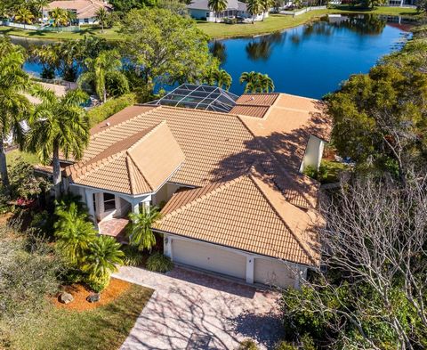 Stunning panoramic lake views take centerstage throughout this beautiful estate home with a 2019 ROOF. Soaring ceilings, expansive windows/glass doors, spacious open living areas, a light and airy interior, huge lanai with saltwater pool and tropical...