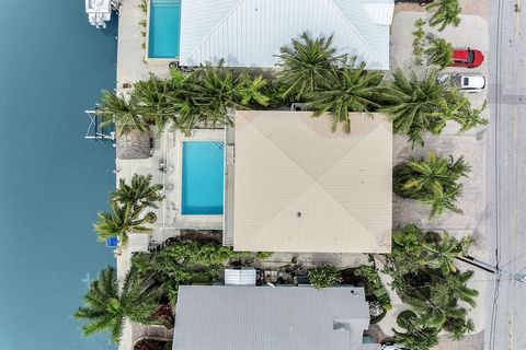 Location! Welcome to your slice of paradise in Key Colony Beach, where this stunning waterfront home offers not only luxurious living but also a prime investment opportunity. Situated in the heart of this scenic destination, with quick access to both...