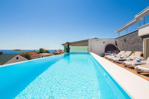 Beautiful villa with a roof swimming pool in the famous tourist place Rogoznica. It is located in the second row to the sea, just 50 meters from the beautiful pebble beach. Total area is 380 sq.m. Land plot is 458 sq.m. The villa offers superb luxury...