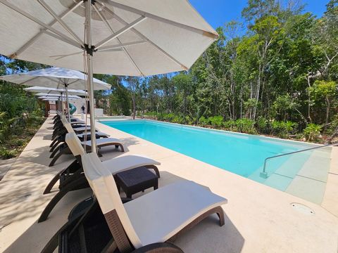 Don t miss the opportunity to acquire this incredible 2 bedroom condominium perfect for those seeking to enjoy tranquility located in a private gated community on the main access road to the beach and hotel zone of Tulum. The unit features a living r...