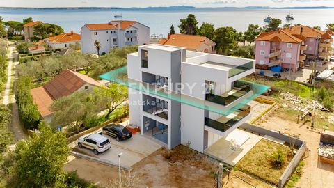 VIR, SOUTH SIDE OF THE ISLAND, APARTMENT ON THE 2ND FLOOR WITH A ROOF TERRACE, WONDERFUL SEA VIEW, ONLY 80 m FROM THE SEA!   For sale is a 2.5-room apartment on the 2nd floor of a residential building with a roof terrace of 42.56 m2 with a wonderful ...