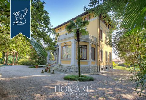 This luxury villa girdled by an elegant, leafy vegetation is currently up for sale in Lesa, province of Novara, at a short distance from Lake Maggiore. This luxury estate sprawls over roughly 355 m² in total, encompasses three floors and a lower-grou...