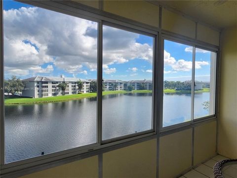 Clean and very spacious apartment with beautiful views of water. This building is located in Pine Island Ridge with excellent A schools nearby. Central AC, Lots of closets. Association fee includes water, cable tv and membership to the Country Club w...