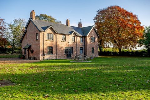 Situated in grounds of just over 3 acres with breathtaking field views and perfect for an equestrian owner, this elegant late Victorian property has been completely renovated over almost three decades and retains many period features. The well-presen...