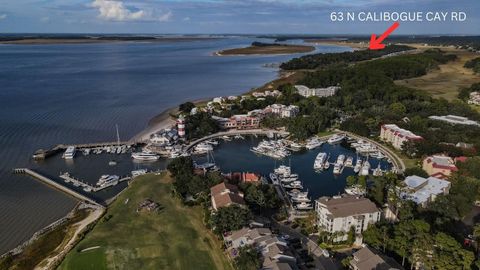 SEA PINES RESORT AWARD-WINNING HOME. EXPERIENCE DEEP WATER VIEWS AND BREATHTAKING SUNSETS FROM YOUR PRIVATE DOCK AND HOME OVERLOOKING CALIBOGUE SOUND. This home is nestled on .77 acres on one of the most sought after streets in Sea Pines Resort. Buil...