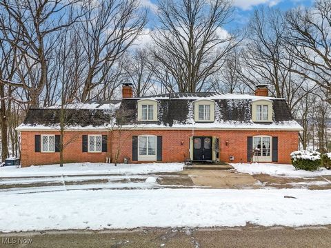 Perched atop a 1.64 acre scenic wooded sanctuary that overlooks the historic Village of Magnolia, this unique colonial offers nearly 6,000 square feet of finished living space, including the sprawling finished walkout basement featuring a large rec r...