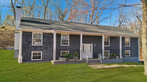 Welcome to 50 Quarry Lane, a captivating four-bedroom, three-bathroom home nestled in the scenic town of Bedford. Situated on a serene, wooded cul-de-sac, this home offers a perfect blend of privacy and convenience, with easy access to the charming d...