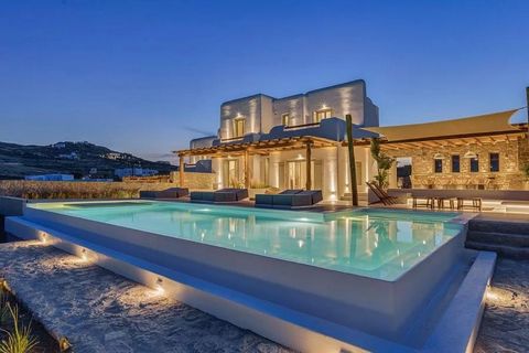 Gadait International presents this sumptuous villa nestled in the heights of Kalafatis, Mykonos. Ideally located just 750 meters from the crystal-clear waters of the Aegean Sea, this exceptional property offers breathtaking views of the rocky landsca...